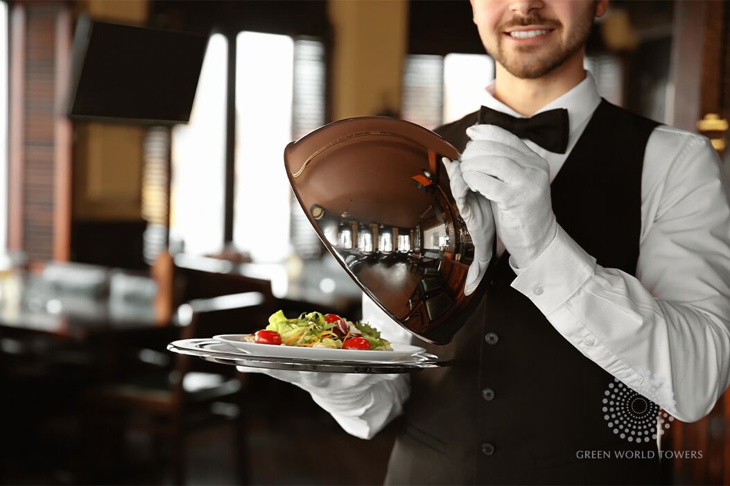 Waiter serving a meal