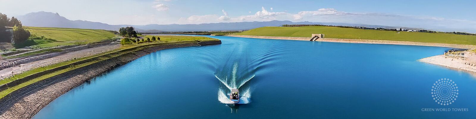 Boat on the lake with hills in the distance